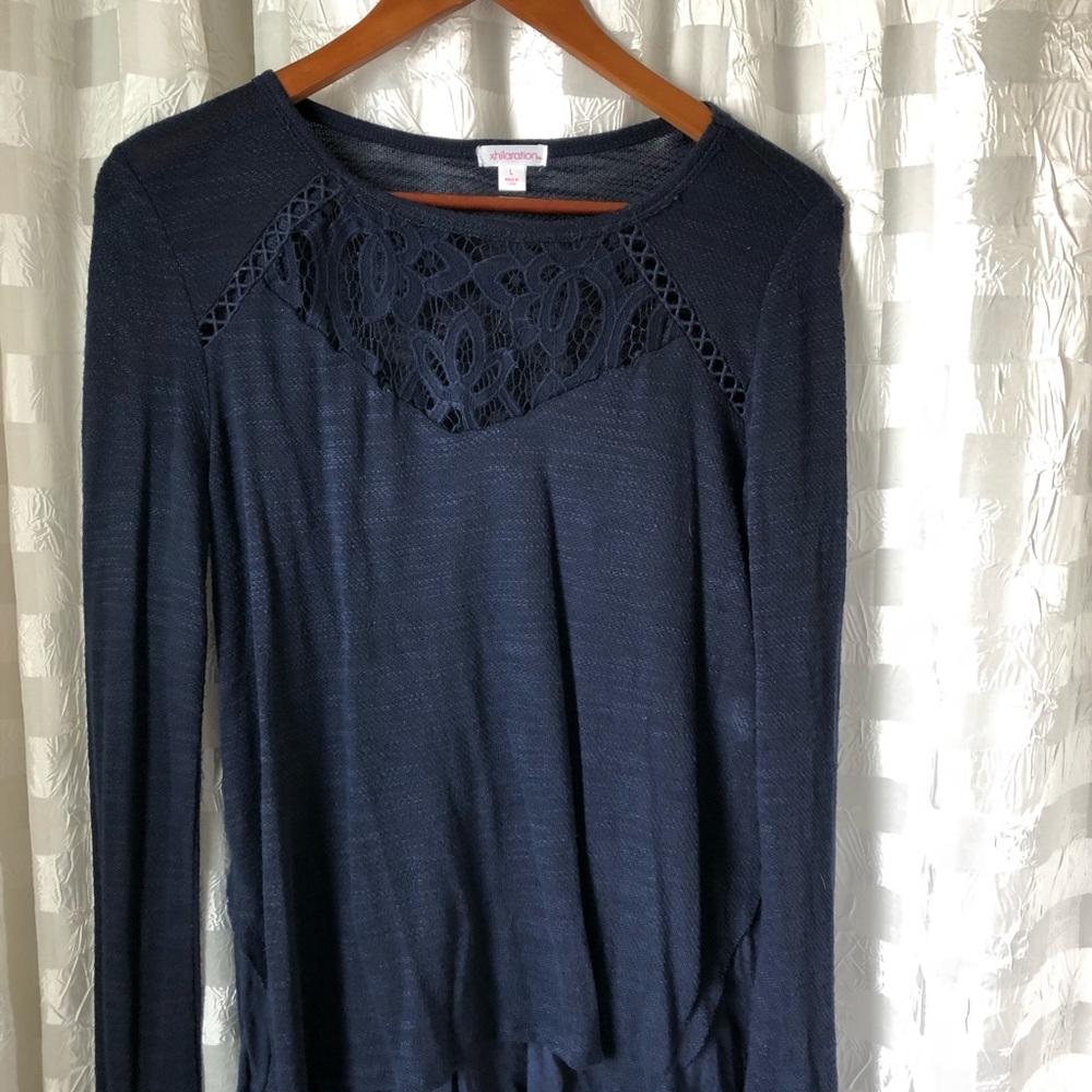 Navy xhilaration sweater with ruffled back.